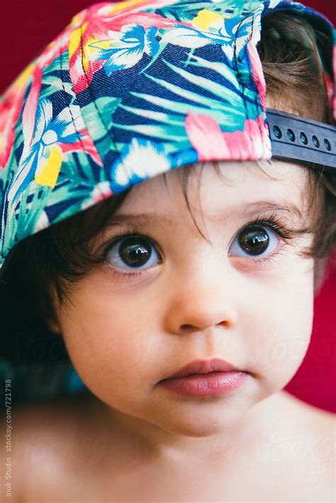 Stylish Baby Wearing A Colourful Flower Cap By Inuk Studio Stylish