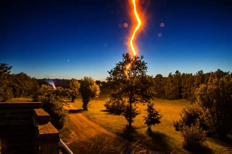 Lightning Strikes Tree In Front Of House During Nighttime · Free Stock