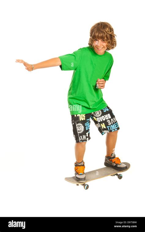 Smiling Teen Boy Skateboarder Isolated On White Background Stock Photo