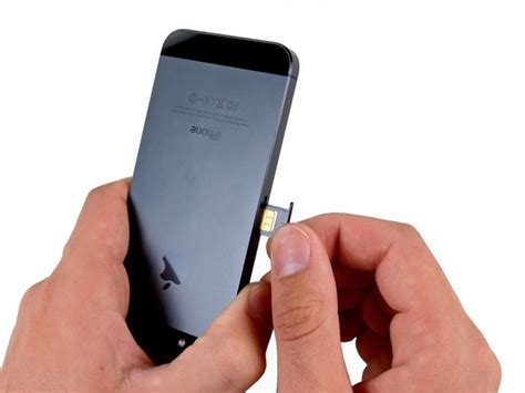 Insert the sim ejecting tool into the hole on the tray. iPhone 5 SIM Card Replacement - iFixit Repair Guide