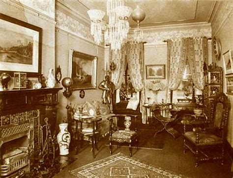 An Old Photo Of A Living Room With Antique Furniture And Paintings On