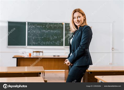 Beautiful Female Teacher Formal Wear Smiling Looking Camera Classroom