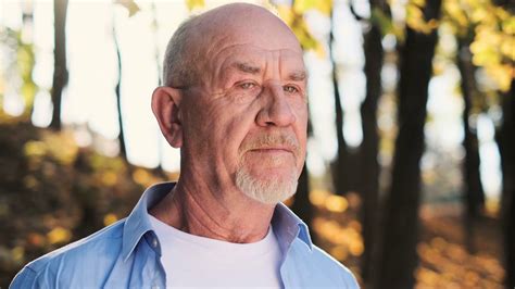 Portrait Of Smiling Bald Senior Man Looking At Camera Portrait Of Happy Mature Grandfather