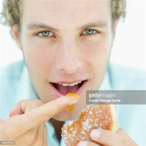 Hungry Man Lick Finger Photos Et Images De Collection Getty Images
