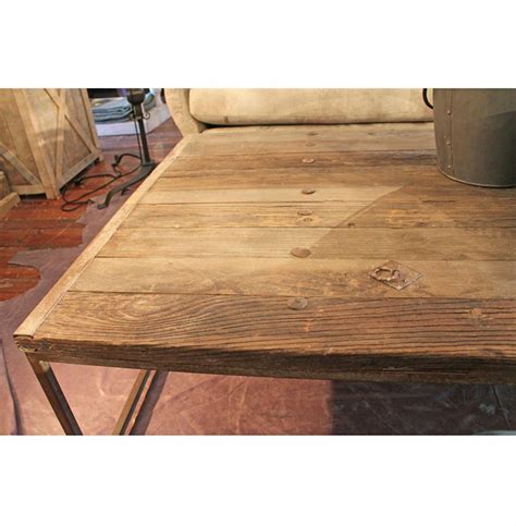 The table top is made from reclaimed elm doors in a natural finish and has a metal gallery reminiscent of antiques from past. Thayer Rustic Lodge Reclaimed Elm Wood Coffee Table | Kathy Kuo Home