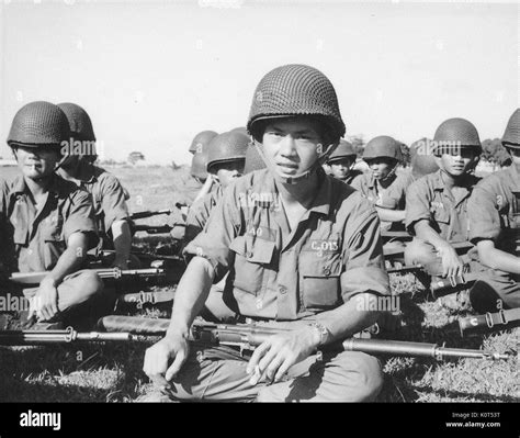 A Group Of Army Of The Republic Of Vietnam Soldiers Seated On The
