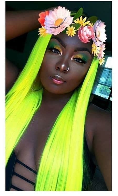 She has aqua hair that can still be counted as green. Who said darkskins couldn't rock vibrant colored hair ...