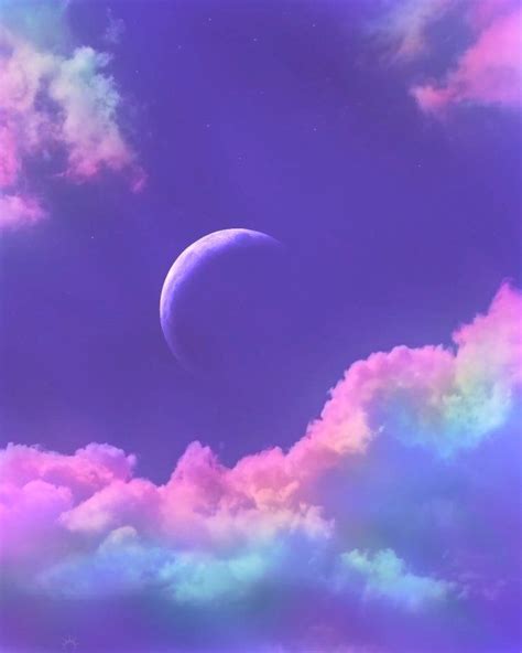 An Image Of The Moon In The Sky With Clouds