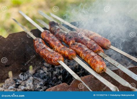 Grilled Sausage On The Picnic Flaming Grill Stock Photo Image Of