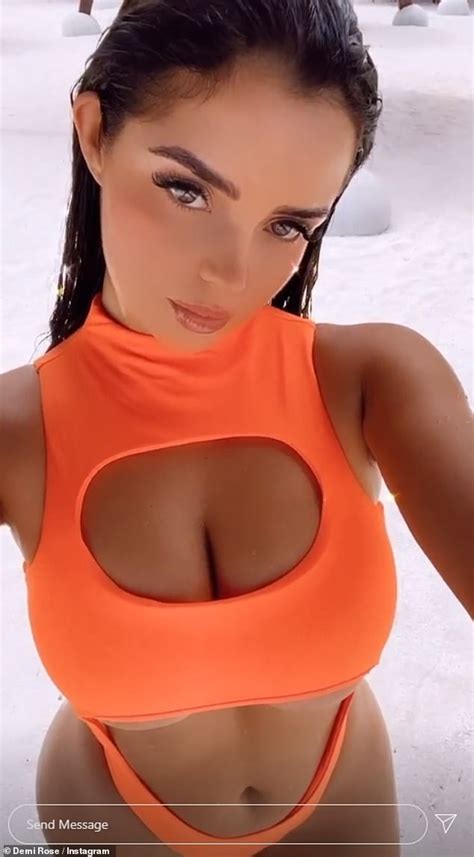 Demi Rose Flaunts Her Ample Cleavage In A Cut Out Neon Orange Swimsuit
