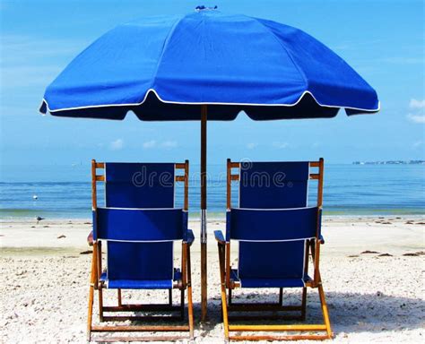 Two Blue Beach Chairs And Umbrella On The Beach Stock Photo Image Of