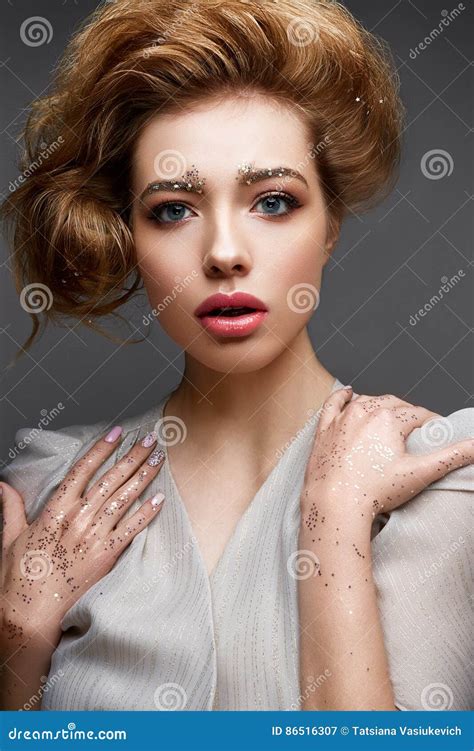 Young Girl With Lush Hairstyle And Make Up Nude Beautiful Model With Sequins On The Eyebrows