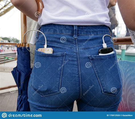 Smartphone And Battery For Charging Mobile Devices In The Back Pockets