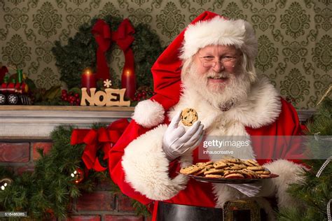 Real Santa Claus Eating Cookies High Res Stock Photo Getty Images