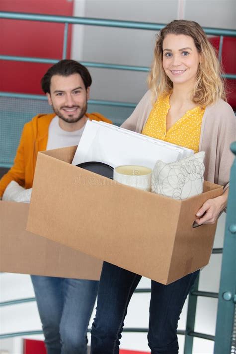 Woman Carrying Box Up Stairs Stock Photos Free And Royalty Free Stock