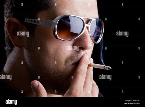 Handsome Model Smoking A Cigarette Stock Photo Alamy