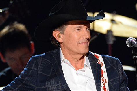 george strait wins entertainer of the year at 2014 acm awards
