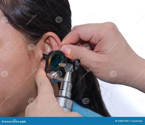 Ent Physician Checking Patient S Ear Using Otoscope With An Inst Stock