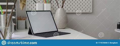 Cropped Shot Of Trendy Office Desk With Blank Screen Tablet Office