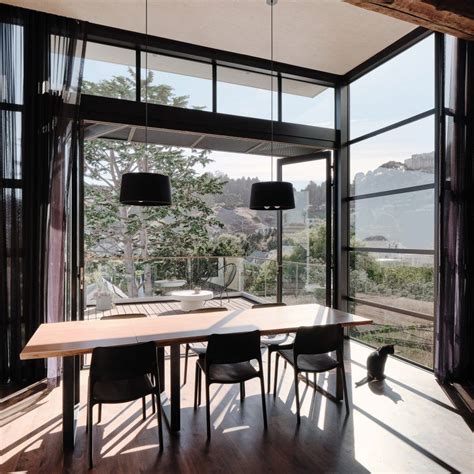 Black Gridded Windows Form Valley Street House Extension In San