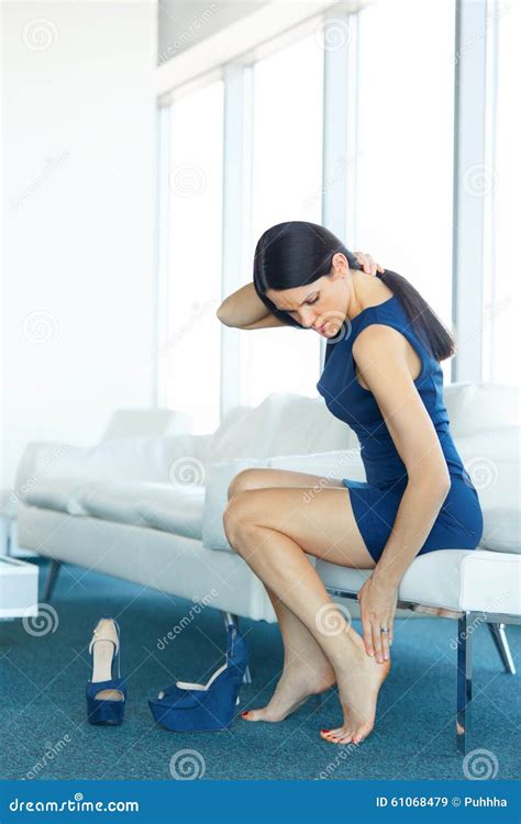 Tired Legs And Feet Of A Young Girl After Wearing Uncomfortable High Heeled Shoes Royalty Free