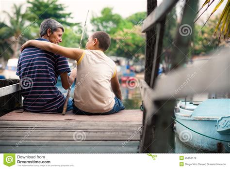 The father also knows that their survival depends upon them conserving their food, so helping others along the road isn't a good option. Old Man And Boy Fishing Together On River For Fun Royalty ...