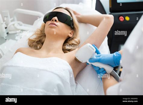 Pretty Woman Having Underarm Laser Hair Removal Procedure In Beauty