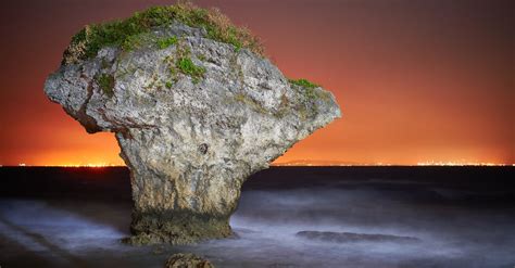 Rock Formation Surrounded By Body Of Water · Free Stock Photo