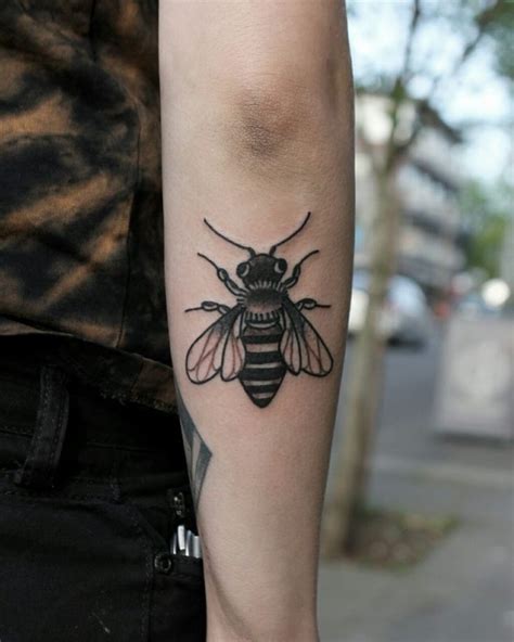 Black Tattoo Of A Bee Inked On The Back Of The Right Forearm Bee