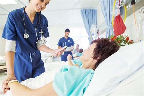 Nurse Examining Patient In Hospital Room Stock Image F0147557