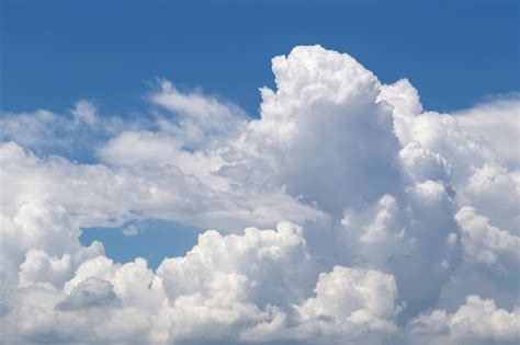 Premium Photo White Fluffy Clouds In The Blue Sky Background