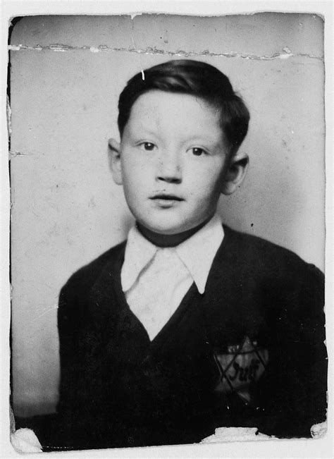 Close Up Photograph Of A Jewish Boy Wearing A Jewish Star