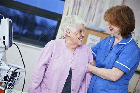 Elderly Woman Being Supported By Nurse Stock Image C0135061