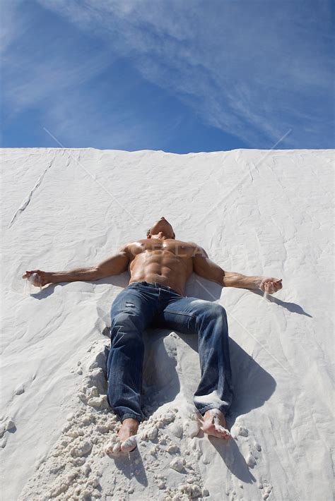 Good Looking Shirtless Man Resting On A Sand Dune In White Sands Nm Rob Lang Images