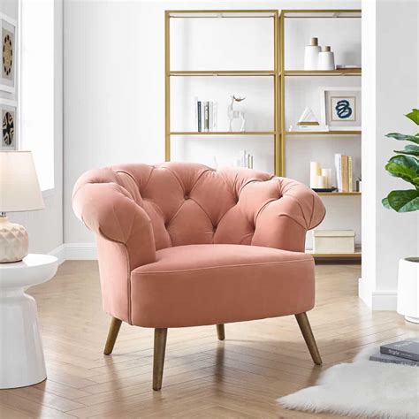 Crafted from plush velvet, this accent chair is the comfortable and stylish place to lounge after long days. Eversley Blush Pink Velvet Armchair - Julian Joseph