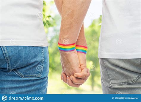 Male Couple With Gay Pride Rainbow Wristbands Stock Image Image Of Partner Couple 150502659