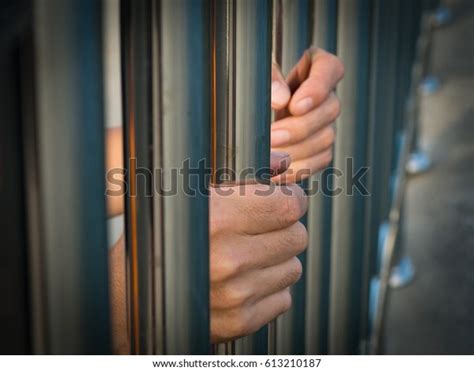 Hand Prisoner Holding Prison Bars Jail Stock Photo Edit Now 613210187