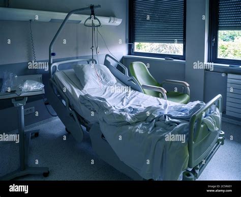 Empty Hospital Ward Bed With Blinds On Windows Inside The Modern