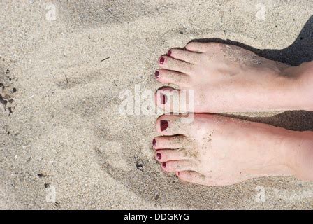 Painted Toenails On A Sandy Beach Stock Photo Alamy