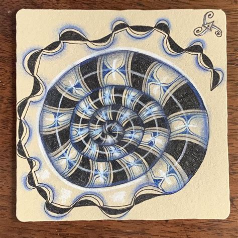 A Drawing Of A Blue And White Spiral On A Piece Of Paper That Is