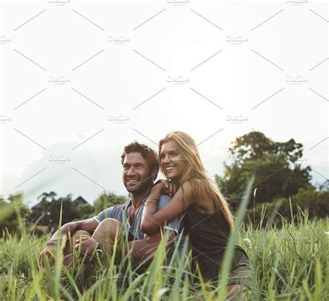 Loving Couple Sitting On Grass Field Grass Field Romantic Moments