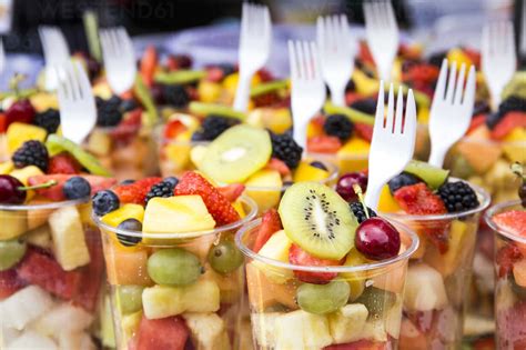 Plastic Cups Of Fruit Salad On Street Market Stock Photo
