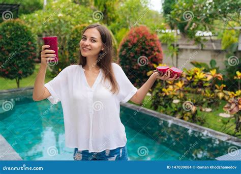 Portrait Vegetarian Girl Holds In Her Hands Glass Of Smoothie And
