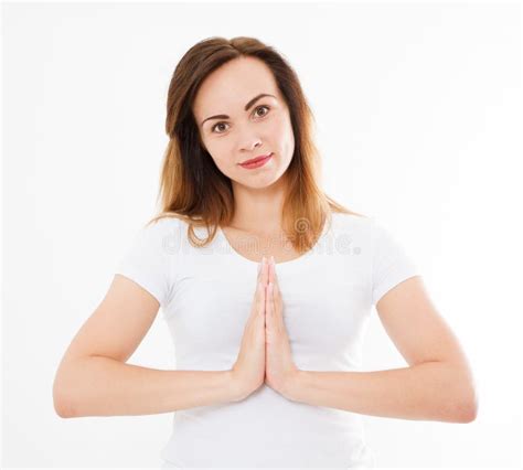 Close Up Of Hands Of Woman In Tshirt Meditating Indoors Focus On