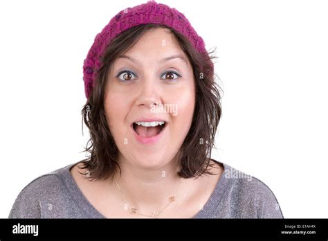 Attractive Woman In A Knitted Cap Reacting In Delight And Pleasure With Sparkling Eyes And Her