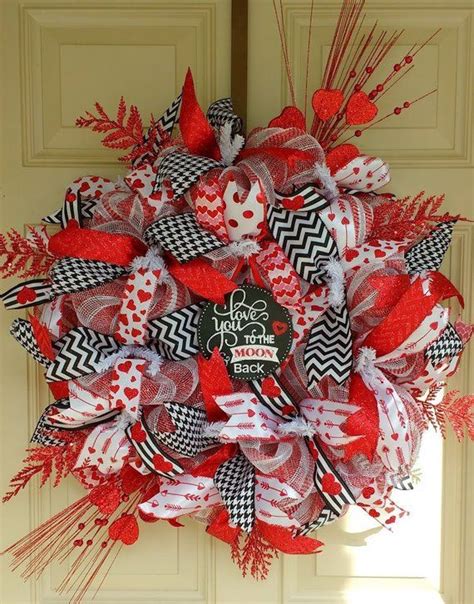 A Red And Black Wreath On The Front Door For Valentines Day Or Any