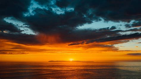 Download Wallpaper 1366x768 Sea Horizon Sunset Clouds Sun Sky