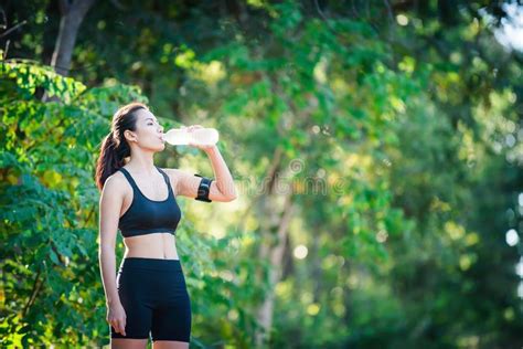 Fitness Woman Drinking Water From Bottle Young Woman At Rural T Stock