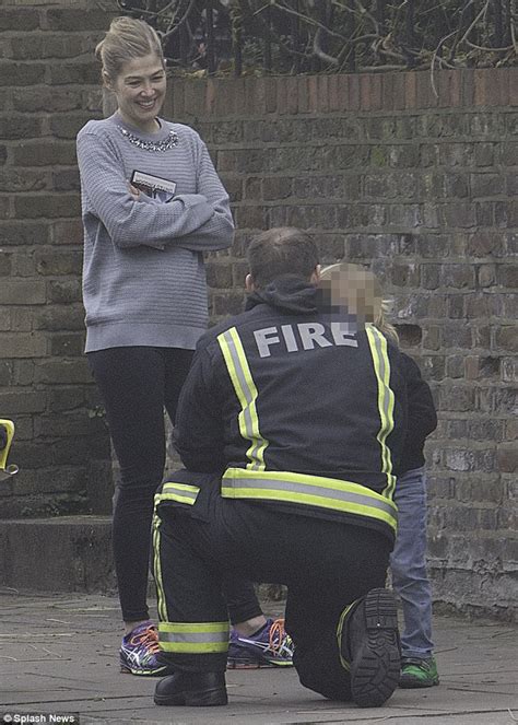 Rosamund Pike Beams As Her Son Solo Chats To A Fireman Near Their London Home Daily Mail Online