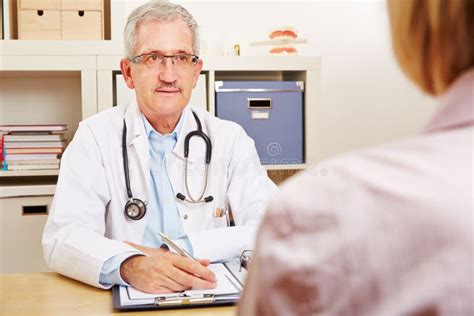 Doctor With Patient During Consultation Stock Photo Image Of Competence Office